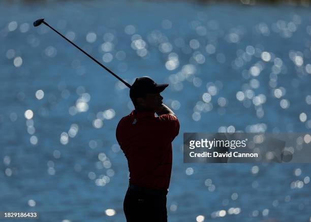Tiger Woods of The United States plays his second shot on the 18th hole during the final round of the Hero World Challenge at Albany Golf Course on...
