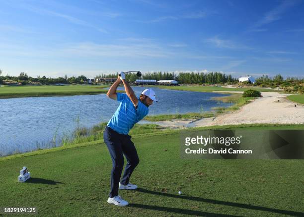 Scottie Scheffler of The United States plays his tee shot on the 18th hole during the final round of the Hero World Challenge at Albany Golf Course...