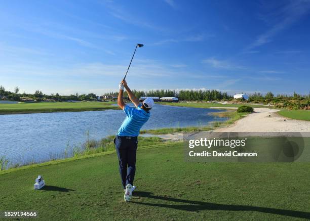 Scottie Scheffler of The United States plays his tee shot on the 18th hole during the final round of the Hero World Challenge at Albany Golf Course...