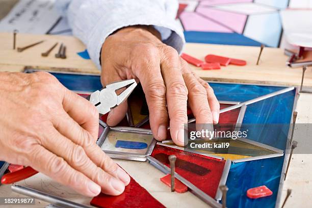 stained glass craftsman working on project - art manke stock pictures, royalty-free photos & images