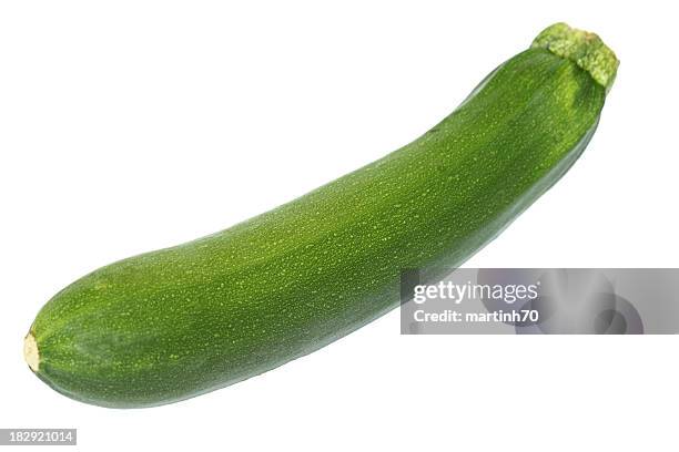 whole green zucchini on a white background - courgette stock pictures, royalty-free photos & images