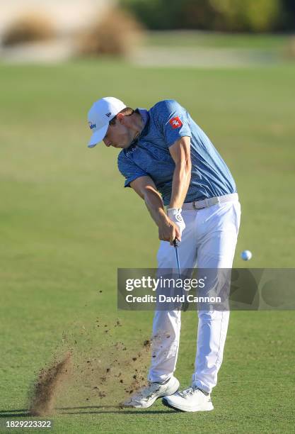 Matthew Fitzpatrick of England plays his second shot on the 15th hole during the final round of the Hero World Challenge at Albany Golf Course on...