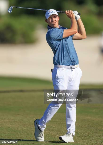 Matthew Fitzpatrick of England plays his second shot on the 13th hole during the final round of the Hero World Challenge at Albany Golf Course on...