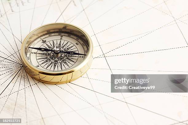 elegant gold compass - cartography stock pictures, royalty-free photos & images