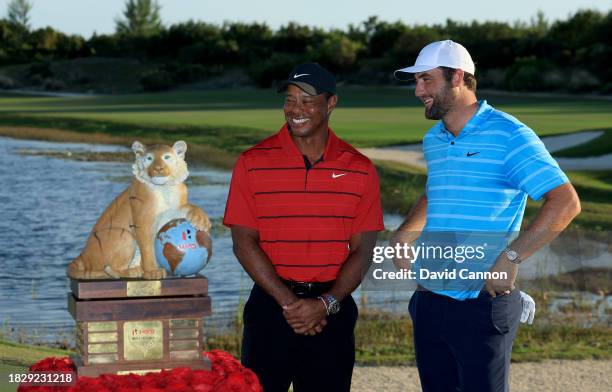 Scottie Scheffler of The United States beside the Hero World Challenge Trophy with tournament host Tiger Woods of The United States after his win in...
