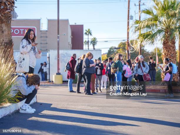 People wait on the outskirts of the UNLV campus after a shooting on December 06, 2023 in Las Vegas, Nevada. According to Las Vegas Metro Police, a...