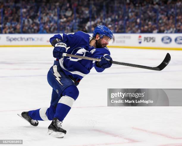 Nikita Kucherov of the Tampa Bay Lightning shoots the puck for a goal against the Pittsburgh Penguins during the second period at Amalie Arena on...