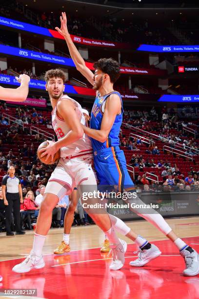 Alperen Sengun of the Houston Rockets handles the ball during the game against the Oklahoma City Thunder on December 6, 2023 at the Toyota Center in...