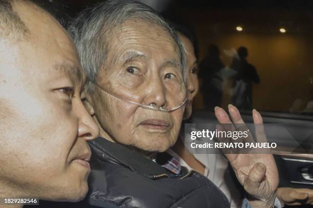 Former Peru's President Alberto Fujimori sits between his children Kenji and Keiko upon his release from the Barbadillo prison in the eastern...