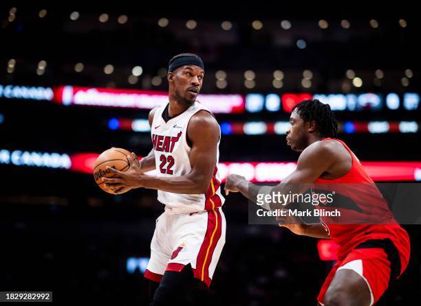 Jimmy Butler of the Miami Heat is guarded by O.G. Anunoby of the Toronto Raptors during the first half of their basketball game at the Scotiabank...