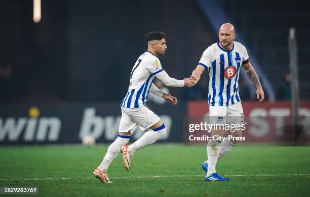 Nader Jindaoui and Toni Leistner of Hertha BSC during the DFB Cup match between Hertha BSC and Hamburger SV on December 6, 2023 in Berlin, Germany.