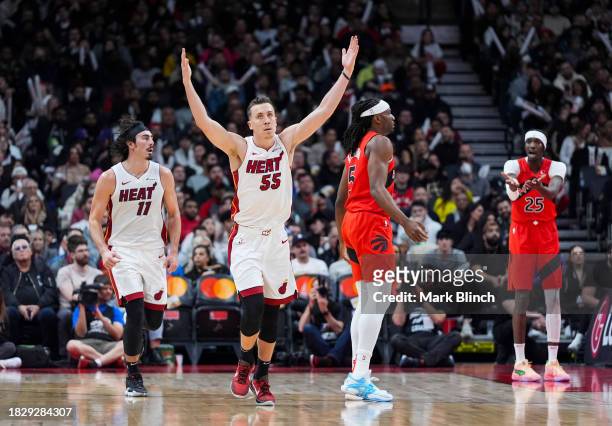 Duncan Robinson of the Miami Heat celebrates a three point shot against the Toronto Raptors during the second half of their basketball game at the...