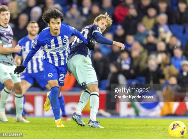 Brighton's Kaoru Mitoma vies for the ball in a Premier League match against Brentford in Brighton, England, on Dec. 6, 2023.