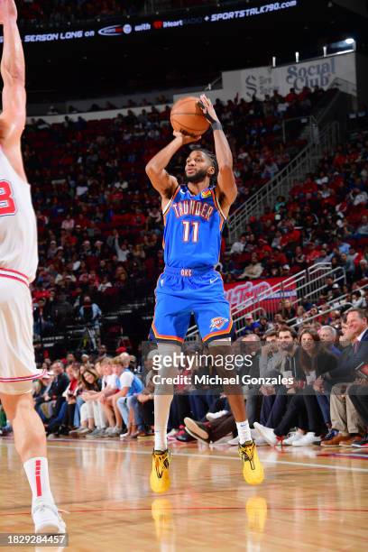 Isaiah Joe of the Oklahoma City Thunder shoots the ball during the game against the Houston Rockets on December 6, 2023 at the Toyota Center in...