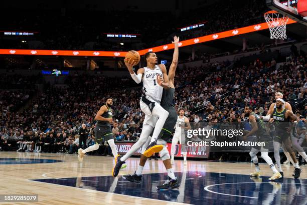 Victor Wembanyama of the San Antonio Spurs drives to the basked with the ball in the third quarter of the game against the Minnesota Timberwolves at...