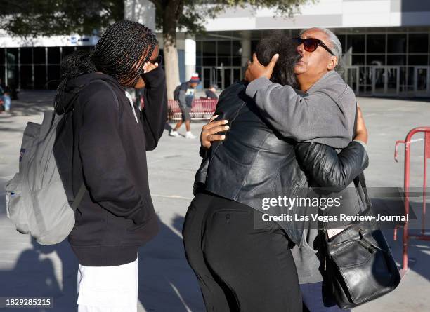 Nyssa Newman, center, a student and employee at the UNLV, reunites with her mother Monique Mitchell Jones and her sister Jordyn Ramsey, left, outside...