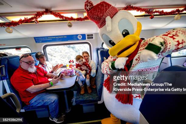 Perris, CA Riders are visited by Donald Duck aboard Metrolink's Holiday Express Train from Perris on Saturday, Nov. 25, 2023.