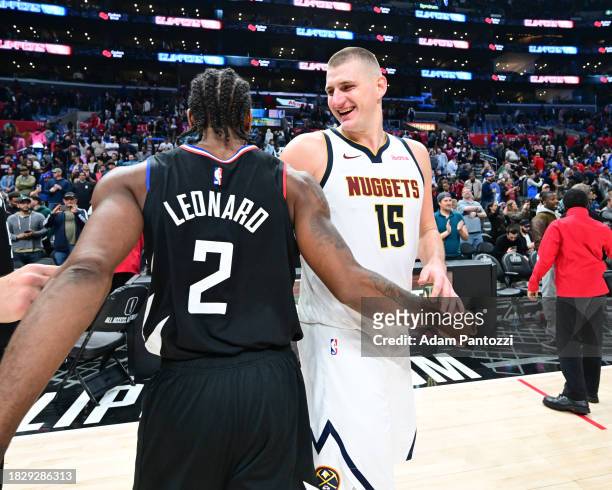 Kawhi Leonard of the LA Clippers & Nikola Jokic of the Denver Nuggets embrace after the game on December 6, 2023 at Crypto.Com Arena in Los Angeles,...