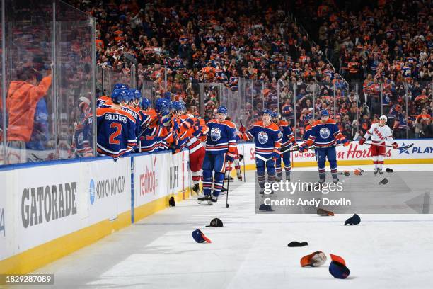 Zach Hyman of the Edmonton Oilers celebrates after scoring his hat-trick third period goal against the Carolina Hurricanes with his teammates at the...