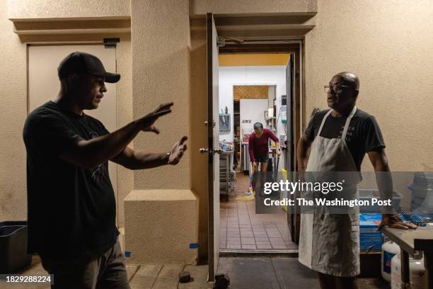 Joey Macadangdang, chef and owner of Joey's Kitchen, speaks with Edgar Bezada, an occupational therapy assistant from central California who flew to...