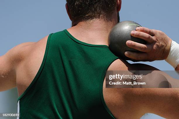 athletic male at shot put - athleticism stockfoto's en -beelden