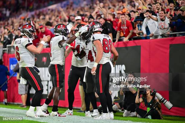 Chris Godwin of the Tampa Bay Buccaneers celebrates with teammates after scoring a touchdown against the Carolina Panthers during the fourth quarter...