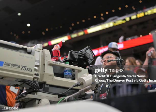 An elf on the shelf sits on top of a camera as the Houston Texans took on the Denver Broncos at NRG Stadium in Houston, Texas on December 3, 2023.