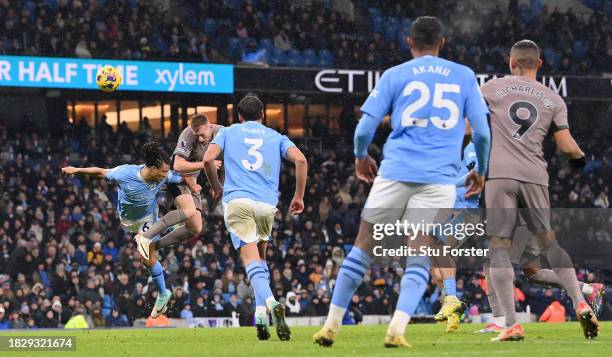 Dejan Kulusevski of Tottenham Hotspur heads to score the team's third goal during the Premier League match between Manchester City and Tottenham...