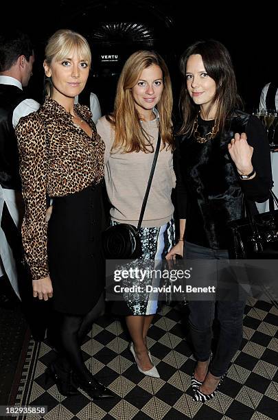 Lady Emily Compton, guest and Arabella Musgrave attend the Vertu launch of the new Constellation smartphone at One Mayfair on October 2, 2013 in...