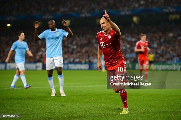 Arjen Robben of Muenchen celebrates his team's third goal during the UEFA Champions League Group D match between Manchester City and FC Bayern...
