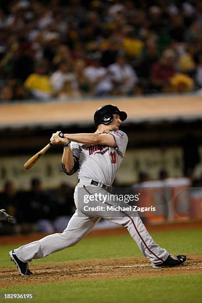 Clete Thomas of the Minnesota Twins bats during the game against the Oakland Athletics at O.co Coliseum on September 20, 2013 in Oakland, California....