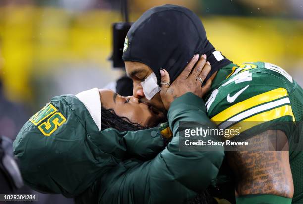 Olympic gold medalist Simone Biles kisses husband Jonathan Owens of the Green Bay Packers before the game between the Kansas City Chiefs and the...