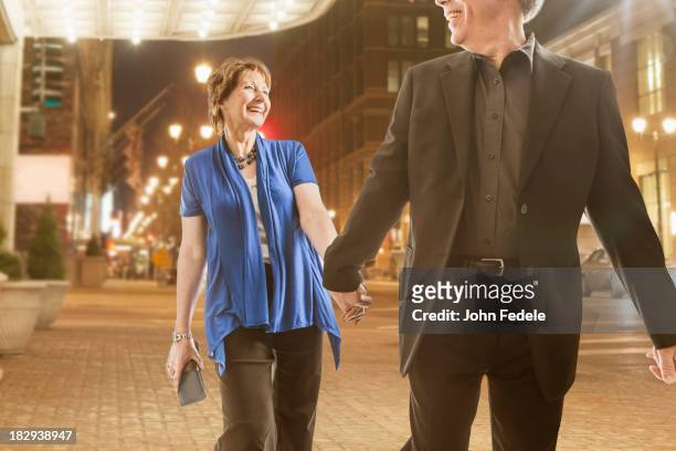 caucasian couple holding hands outdoors - theatre in pisa fotografías e imágenes de stock
