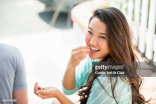 japanese woman eating outdoors - jelly sweet stock pictures, royalty-free photos & images