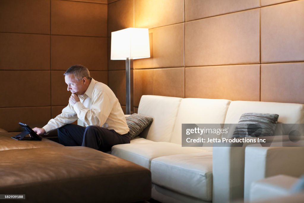 Caucasian businessman using tablet computer