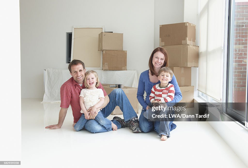 Caucasian family smiling in new home