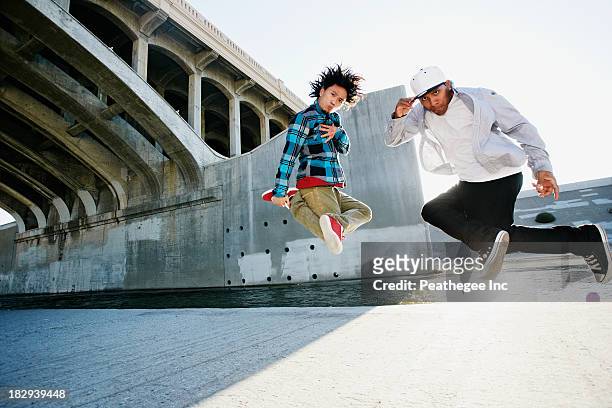 men break dancing under overpass - a la moda stock pictures, royalty-free photos & images