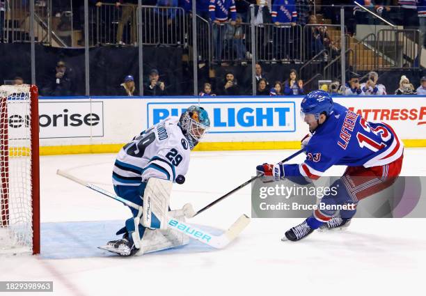 Mackenzie Blackwood of the San Jose Sharks stops Alexis Lafreniere of the New York Rangers on the second period penalty shot at Madison Square Garden...