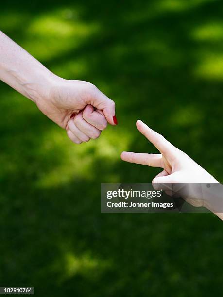 hands playing rock-paper-scissors - rock paper scissors stock pictures, royalty-free photos & images