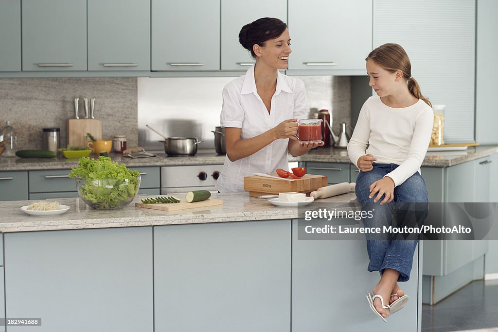 Mother and daughter cooking together