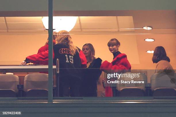 Taylor Swift stands in a suite before the game between the Kansas City Chiefs and the Green Bay Packers at Lambeau Field on December 03, 2023 in...