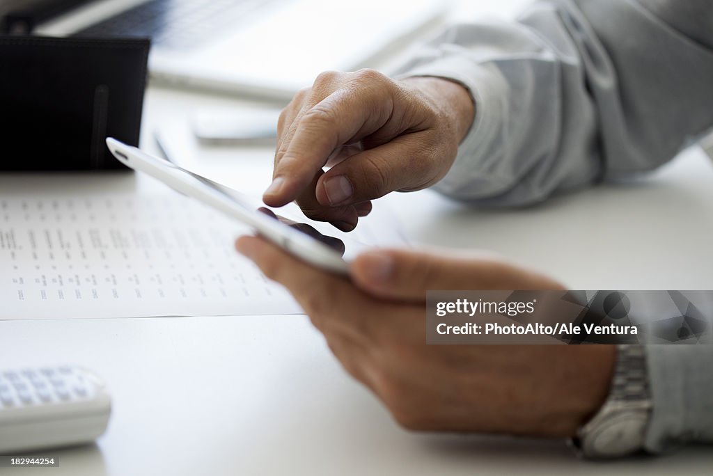 Man using touch screen on Digital tablet, cropped