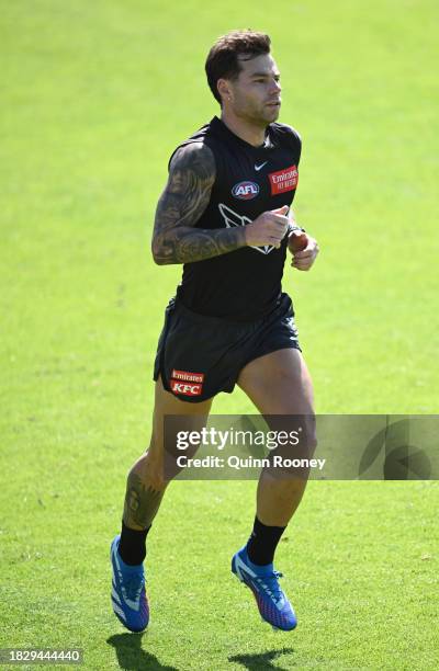 Jamie Elliott of the Magpies runs laps during a Collingwood Magpies training session at Victoria Park on December 04, 2023 in Melbourne, Australia.