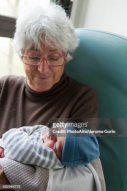Grandmother holding newborn baby