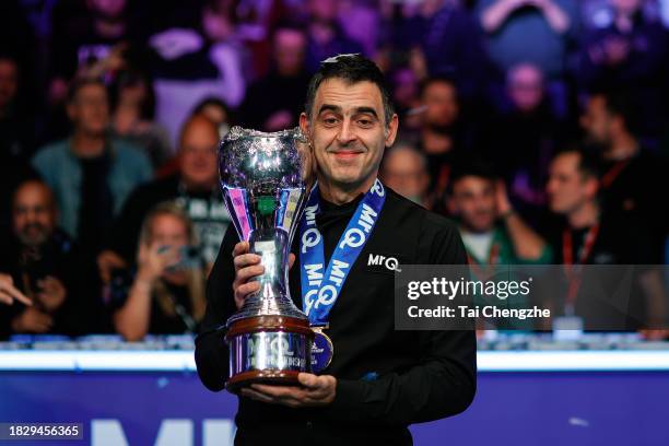 Ronnie O'Sullivan of England poses with the trophy after winning the Final match against Ding Junhui of China on day 9 of the 2023 MrQ UK...