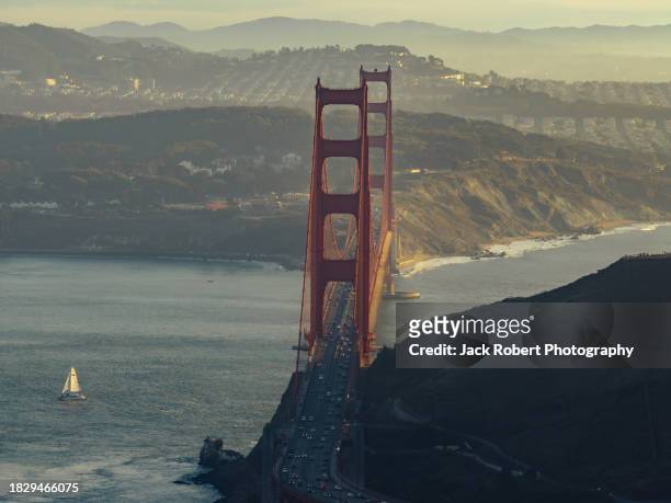 golden gate bridge at dusk with coastal hills - san francisco bay stock pictures, royalty-free photos & images