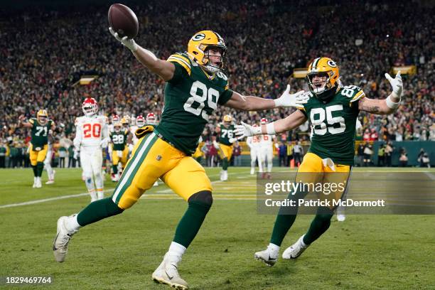 Ben Sims of the Green Bay Packers celebrates with Tucker Kraft after scoring a touchdown during the first quarter against the Kansas City Chiefs at...