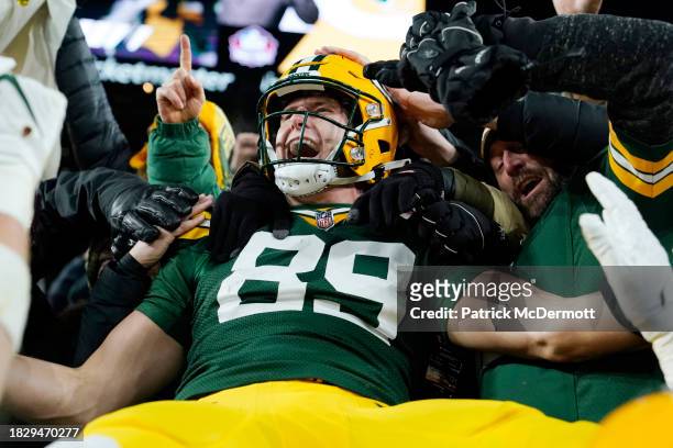 Ben Sims of the Green Bay Packers celebrates with fans after scoring a touchdown during the first quarter against the Kansas City Chiefs at Lambeau...