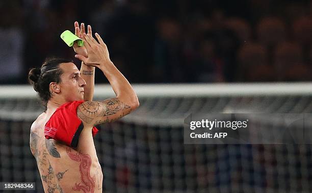 Paris Saint-Germain's Swedish forward Zlatan Ibrahimovic celebrates after winning a Group C Champions League football match between Benfica and Paris...