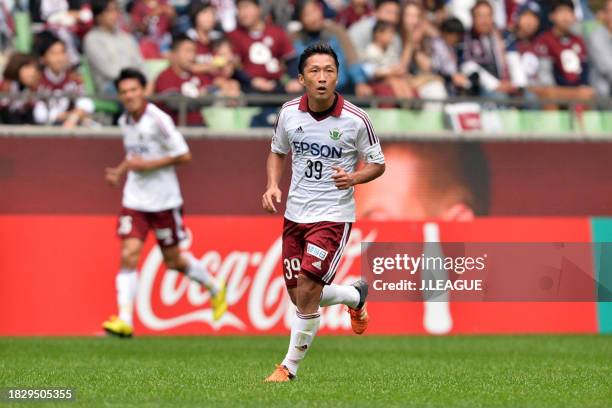 Yoshiro Abe of Matsumoto Yamaga celebrates after scoring the team's first goal during the J.League J1 second stage match between Vissel Kobe and...